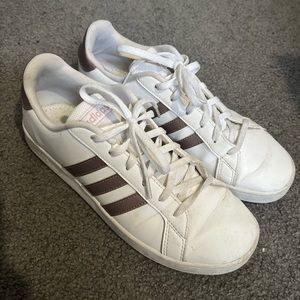 Rose gold and white adidas sneakers